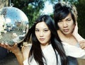 Young couple holding disco mirror ball Royalty Free Stock Photo