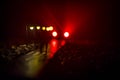 Young couple holding each other hands. Slowly walking under white street lights in night. Dark time. Peaceful atmosphere in mist. Royalty Free Stock Photo