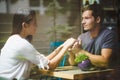 Young couple holding hands in cafe