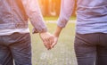 A young couple holding hands. In Nature sunrise Royalty Free Stock Photo