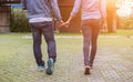 A young couple holding hands. In Nature sunrise Royalty Free Stock Photo