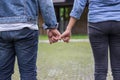 A young couple holding hands. In Nature sunrise Royalty Free Stock Photo