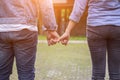 A young couple holding hands. In Nature sunrise Royalty Free Stock Photo