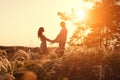 Young couple holding hands. In nature sunrise Royalty Free Stock Photo