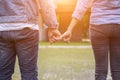 A young couple holding hands. In Nature sunrise Royalty Free Stock Photo