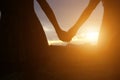 Young couple holding hands. In Nature sunrise Royalty Free Stock Photo