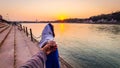 Young couple holding hands at sunset at ganges river bank from different angle Royalty Free Stock Photo