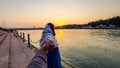 Young couple holding hands at sunset at ganges river bank from different angle image is taken at ganga river bank rishikesh Royalty Free Stock Photo