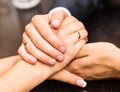 Young couple are holding hands Royalty Free Stock Photo