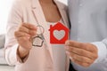 Young couple holding key and house model Royalty Free Stock Photo