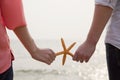 Young Couple Holding Starfish Royalty Free Stock Photo