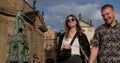 A young couple holds hand on a walk in the old city. Tourist walk in a new place Royalty Free Stock Photo