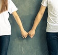 Young couple holds hands affectionately Royalty Free Stock Photo