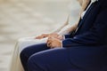 The young couple holds hands during the wedding