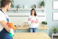 Young couple at home doing hosehold chores Royalty Free Stock Photo