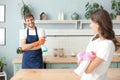 Young couple at home doing hosehold chores Royalty Free Stock Photo