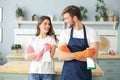 Young couple at home doing hosehold chores Royalty Free Stock Photo