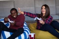 Young Couple at home Playing Video Game Together Royalty Free Stock Photo