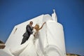 Young couple honeymoon on the most romantic island Santorini, Greece