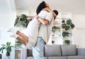 Young couple, hug and jump in new house, real estate and apartment lounge with love. Happy homeowners hugging to