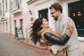 Young couple hugging on the city street in winter Royalty Free Stock Photo