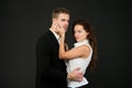 Young couple is hugging each other. attractive girl with handsome man in passionate pose. impassioned girl caresses
