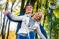 Young couple hugging and flirting in park. Royalty Free Stock Photo