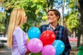 Young couple hugging and flirting in park. Royalty Free Stock Photo