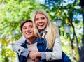 Young couple hugging and flirting in park. Royalty Free Stock Photo