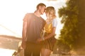 young couple hugging and going to kiss on river beach Royalty Free Stock Photo