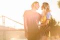young couple hugging and going to kiss on river beach Royalty Free Stock Photo