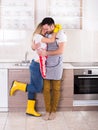 Young couple hugging after housework Royalty Free Stock Photo