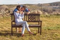 Young couple  Hugging, kissing and enjoying spending time together while celebrating Saint Valentine`s Day in the countryside. Royalty Free Stock Photo