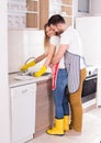 Young couple hugging in kitchen Royalty Free Stock Photo