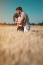 Young couple hugging in the wheat field Royalty Free Stock Photo