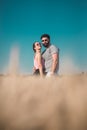 Young couple hugging in wheat field in summertime Royalty Free Stock Photo