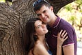Young couple hugs over summer nature outdoor