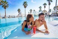 Young couple on infinity pool cocktails Royalty Free Stock Photo