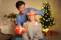 Young couple interchanging gifts on Christmas eve