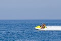 Young Couple on Jet Ski fast ride