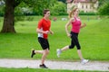 Young couple jogging in park Royalty Free Stock Photo