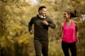 Young couple jogging together in park Royalty Free Stock Photo