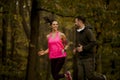 Young couple jogging together in park Royalty Free Stock Photo