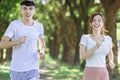 Young couple jogging together in the  park on sunny day Royalty Free Stock Photo
