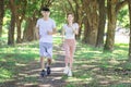 Young couple jogging together in the  park on sunny day Royalty Free Stock Photo