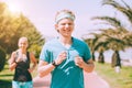 Young couple jogging together in summer day. Active healthy life concept image Royalty Free Stock Photo