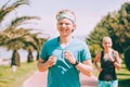 Young couple jogging together in summer day. Active healthy life concept image Royalty Free Stock Photo