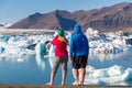 Young couple at Jokulsarlon, glacial lagoon, Iceland Royalty Free Stock Photo