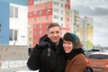 Young couple with keys  near high rises Royalty Free Stock Photo