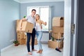 Young couple with keys in new home